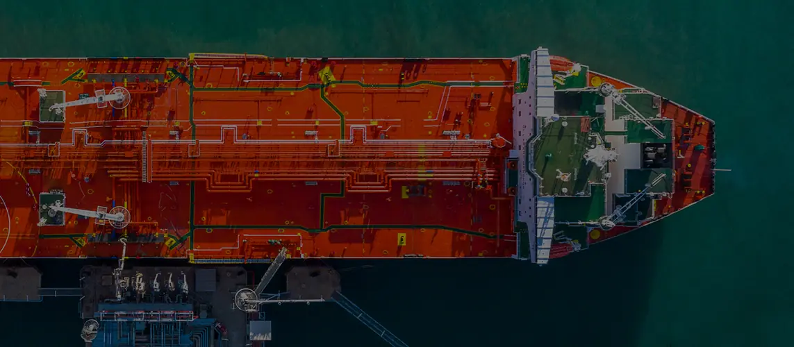 Bow of a red-hulled tanker seen from above